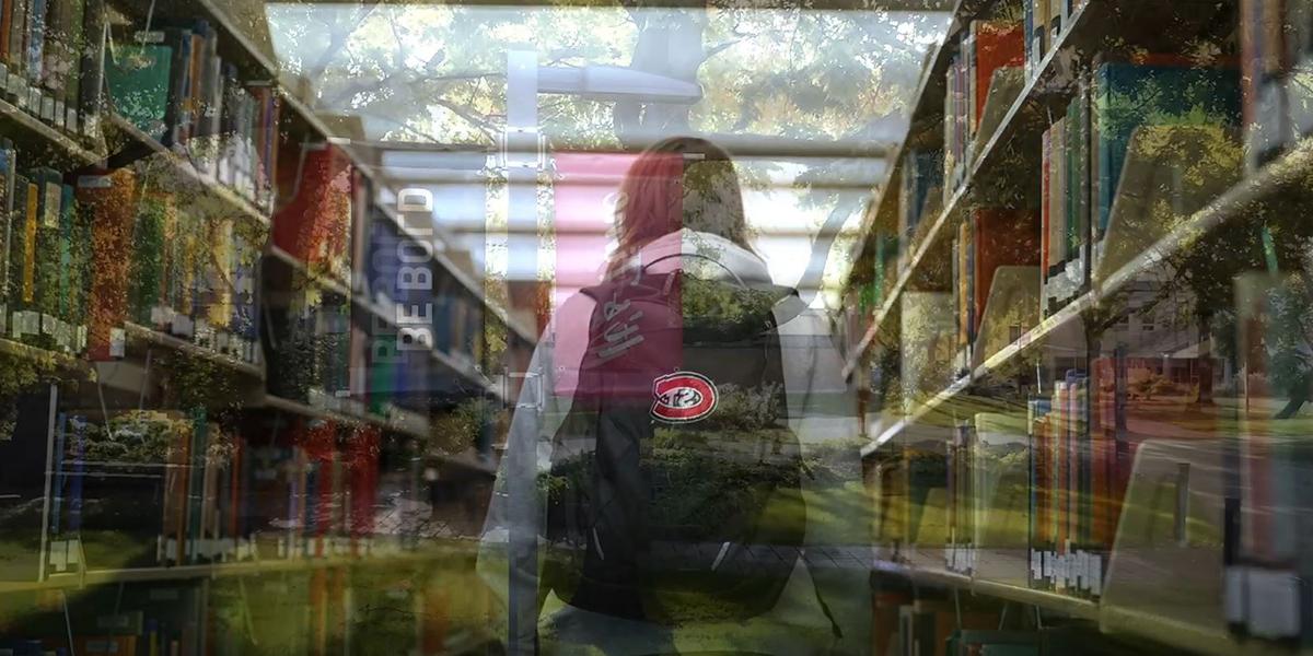 Student walking through library